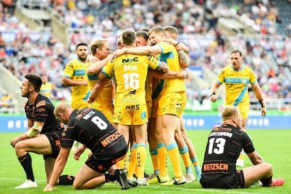 Rhinos celebrate a try by Aidan Sezer during last year's Magic Weekend win over Tigers. Picture by Will Palmer/SWpix.com.