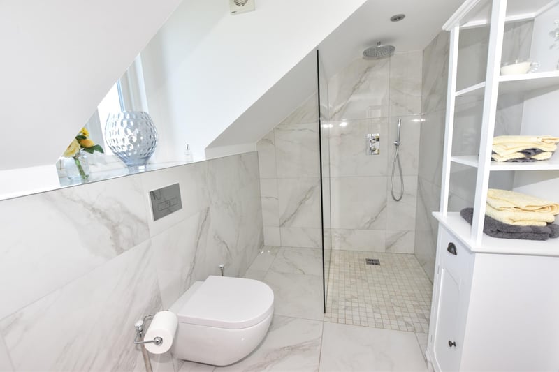 On the second floor, there is a further generous double bedroom with this ensuite shower room and a walk-in wardrobe.