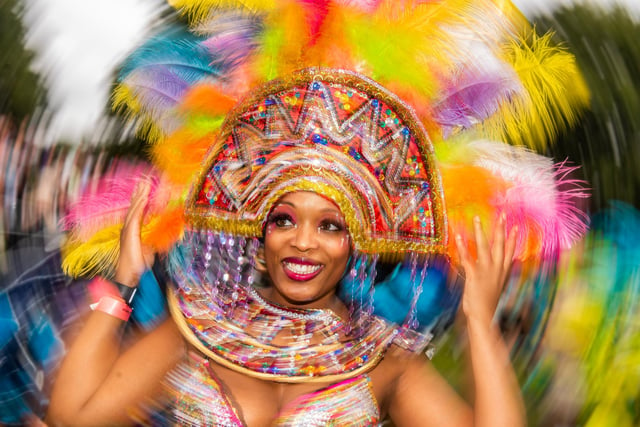 It would not be the same without its signature extravagance, with vibrantly clad revellers parading to the sounds of steel pan and soca music