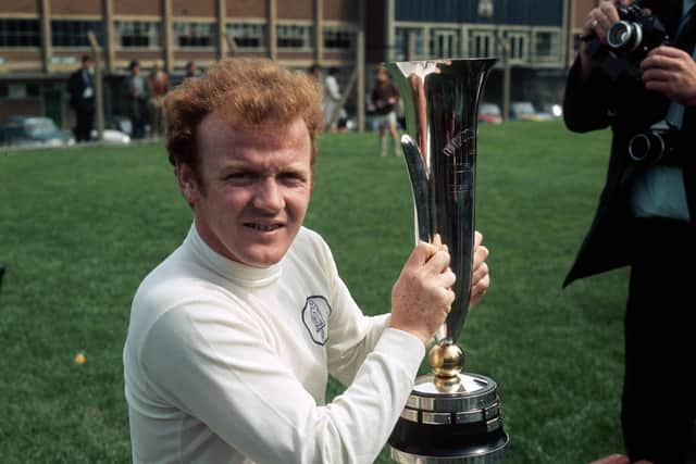 1971:  Leeds United's Billy Bremner (1942 -1997) holds up the Fairs' Cup (UEFA Cup) which his team won after beating Juventus over two legs. Bremner was a key midfielder in Don Revie's team and was voted Player of the Year in 1970. He played 54 times for Scotland and went on to manage Leeds and Doncaster Rovers.  (Photo by Aubrey Hart/Express/Getty Images)