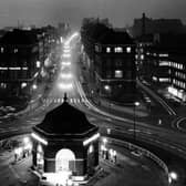 A view up Eastgate and The Headrow late evening in November 1963.