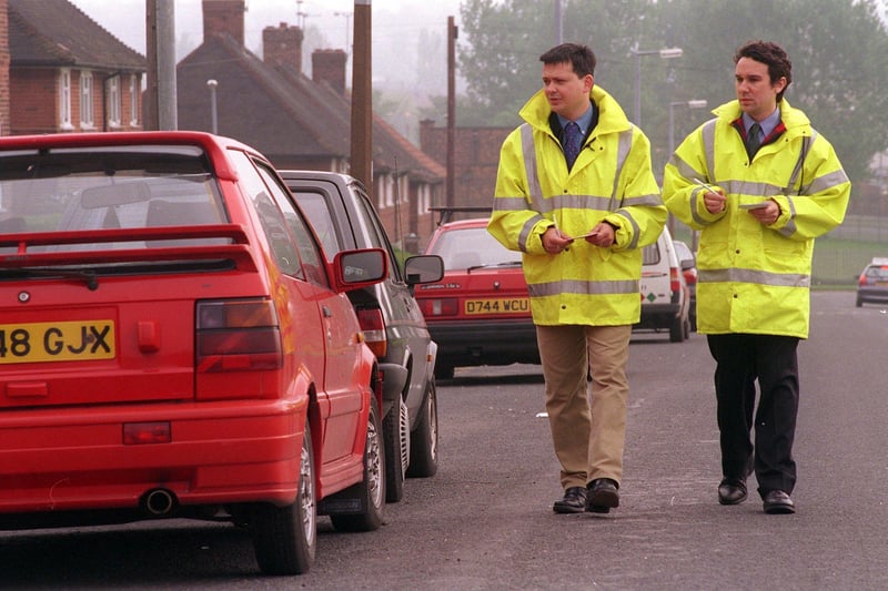 DVLA Inspectors Ian Dyda, left, and Peter Shanahan check cars on Coldcotes Drive in April 1999.