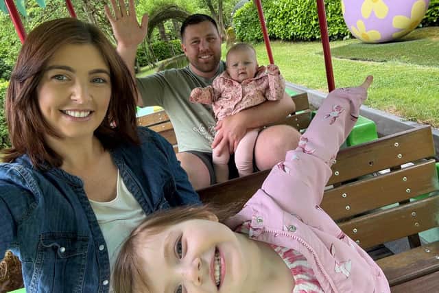 Becca, Luke and their two young children.