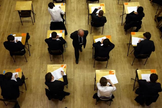 Universities may get rid of predicted grade offers and replace them with actual exam results (PA Media)