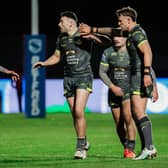 Chris Hankinson, right and Jack Bird congratulate Jake Connor, middle of pictire, on his 40-20 kick in Leeds Rhinos' win at Bradfordf Bulls. Picture by Alex Whitehead/SWpix.com.