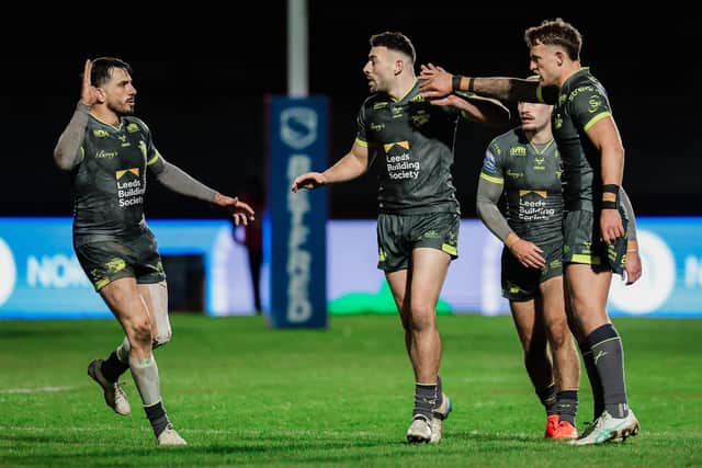 Chris Hankinson, right and Jack Bird congratulate Jake Connor, middle of pictire, on his 40-20 kick in Leeds Rhinos' win at Bradfordf Bulls. Picture by Alex Whitehead/SWpix.com.