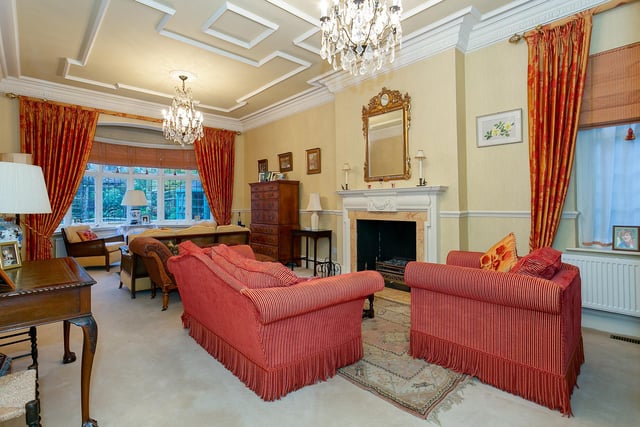 A light and spacious reception room with decorative detail to the ceiling.
