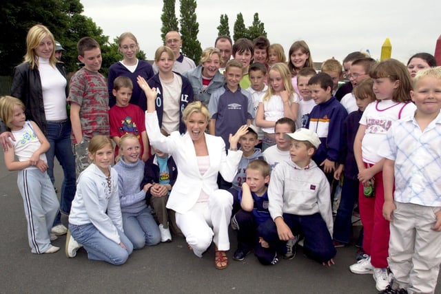 Model and TV star Nell McAndrew made a surprise visit to Bramley St Peter's Primary School summer fete in June 2003.