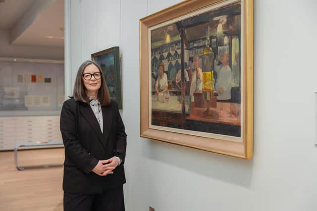 Exhibition curator Dr Kerry Harker with Maurice de Sausmarez’s painting 'Whitelocks' Credit University of Leeds Library Galleries. Picture: Mark Webster