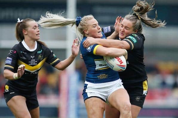 Rhinos' Amy Hardcastle is tackled by Jasmine Bell of York Valkyrie. Picture by Ed Sykes/SWpix.com.