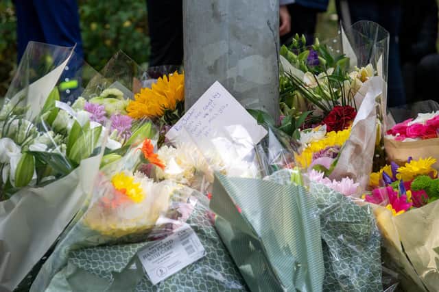 Flowers were left at the scene. Image: Bruce Rollinson