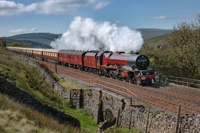 Letting off steam ... the Northern Belle thunders over the Settle-Carlisle line