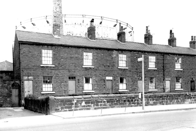 A row of properties on Meanwood Road. In the background is a gasometer. Pictured in April 1967.