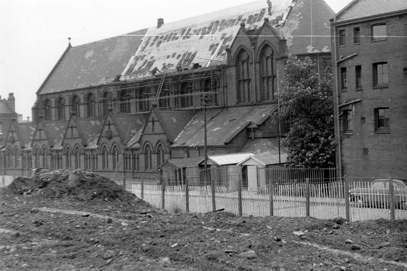 St. Patrick's Roman Catholic Church located in Rider Street at the junction with New York Road. Re-tiling is being carried out on the roof. In the foreground land clearance is taking place alongside Rider Street.