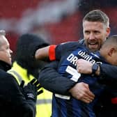 Luton Town manager Rob Edwards hugs Cody Drameh at the end of the Sky Bet Championship match at Bramall Lane, Sheffield. Picture date: Saturday March 11, 2023. (Picture credit: PA/Will Matthews)