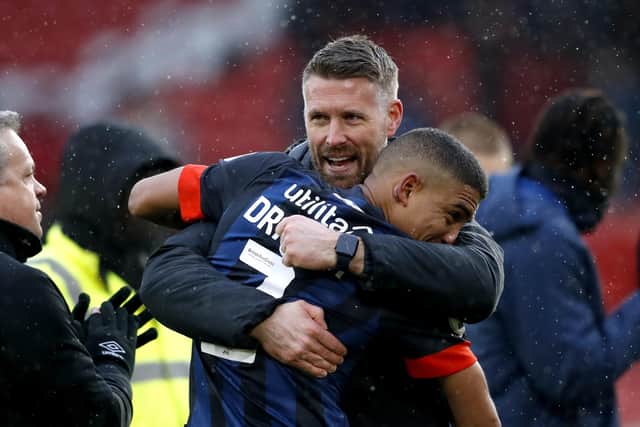 Luton Town manager Rob Edwards hugs Cody Drameh at the end of the Sky Bet Championship match at Bramall Lane, Sheffield. Picture date: Saturday March 11, 2023. (Picture credit: PA/Will Matthews)