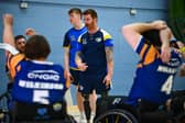 Leeds Rhinos wheelchair coach James Simpson talks to his players. Picture by Olly Hassell/SWpix.com.