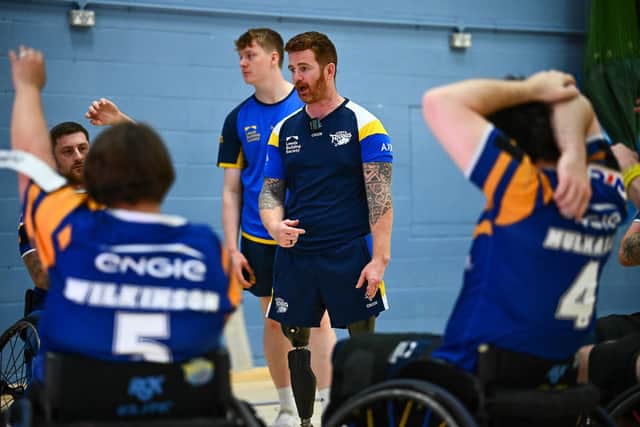 Leeds Rhinos wheelchair coach James Simpson talks to his players. Picture by Olly Hassell/SWpix.com.