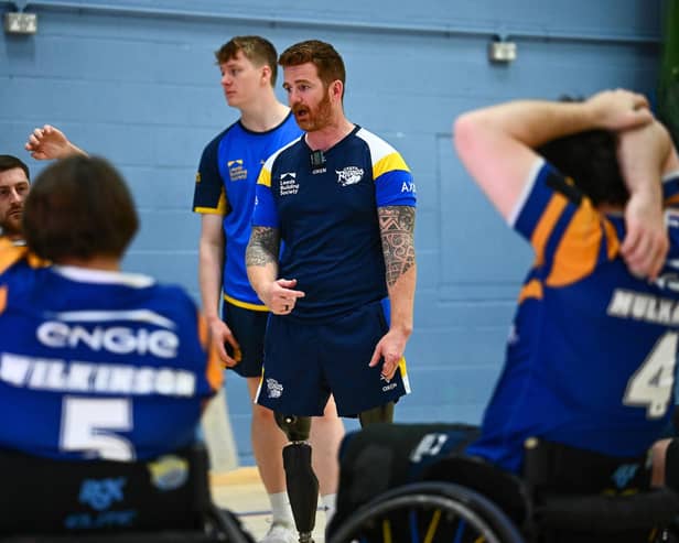 Leeds Rhinos wheelchair coach James Simpson talks to his players. Picture by Olly Hassell/SWpix.com.