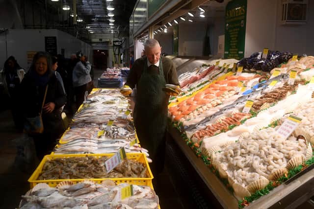 Fishmonger Stephen Myers on his stall on the market.Picture taken by Yorkshire Post Photographer Simon Hulme