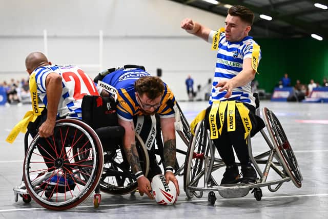 Josh Butler scores for Leeds Rhinos in their Betfred Wheelchair Challenge Cup final defeat by Halifax Panthers at Robin Park Arena in Wigan. Picture by Olly Hassell/SWpix.com.
