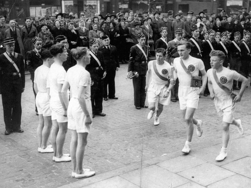 The 13th company of the Leeds Battalion of the Boys Brigade in front of Leeds Town Hall. This was during the Festival of Britain and the occasion was the relaying of five loyal messages to the King by trios of Boys Brigade members from all over the country. The northern contingent set out from John O'Groats, and arrived at Buckingham Palace on May 10. The trio setting off from the Town Hall ran to Whingate junction before handing on to another trio. The members from Leeds were Cpl. G. Higgins, Sgt. J. Ladley and L/Cpl. B. Parker.