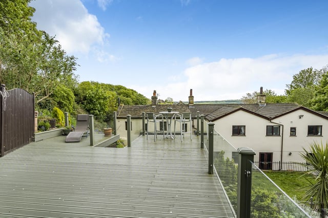 The rear garden features composite decking at the top, which is raised above the garden creating a peaceful place to soak up the views over the top of the house whilst still enjoying privacy. Picture: Linley and Simpson.