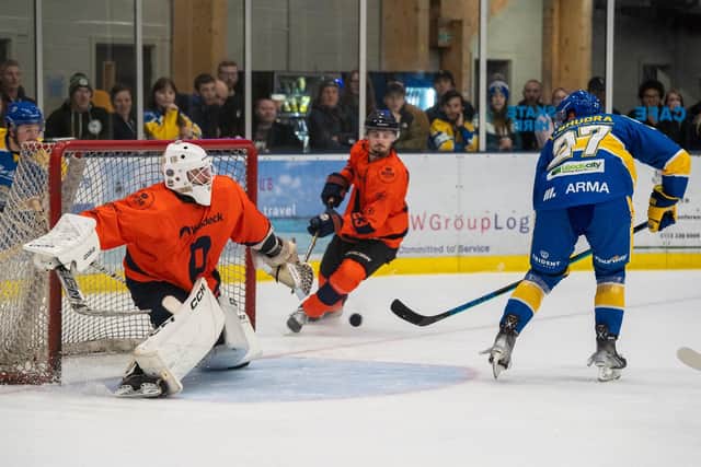 GET IN: Cole Shudra (right) backhands past Peterborough Phantoms' netminder Jordan Marr to make it 4-0 to hosts Leeds Knights at Elland Road Ice Arena on Saturday night. Picture courtesy of Oliver Portamento.