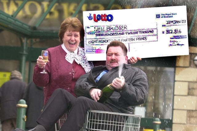 Neil Bridger who had bought a winner lottery ticket from Morrison's in Yeadon scooping £312,814. He is pictured in January 2003 with checkout operator Christine Potter who sold him the ticket.