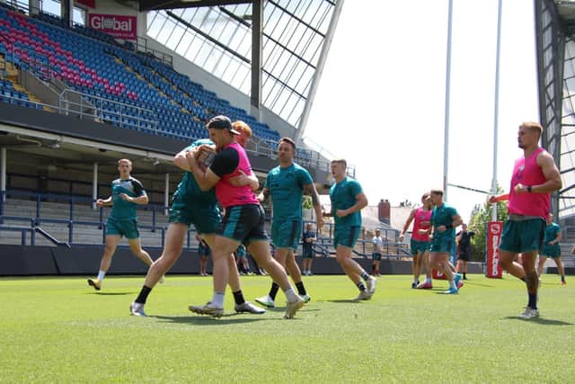 Charlie Venables, left in pink top, joins in a Rhinos training session. Picture by Phil Daly/Leeds Rhinos.