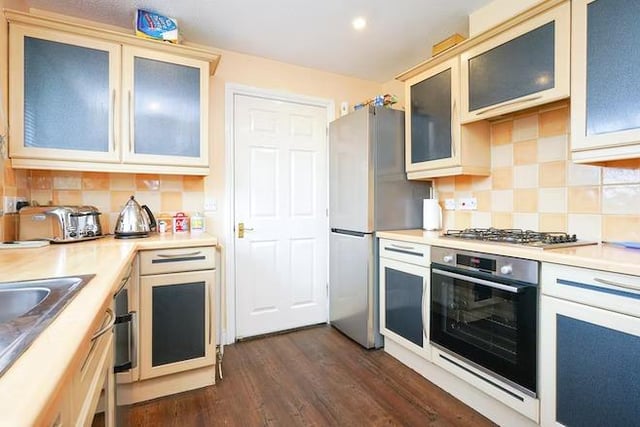 The kitchen is well fitted with a range of wall and base mounted units with complimentary work surfaces.