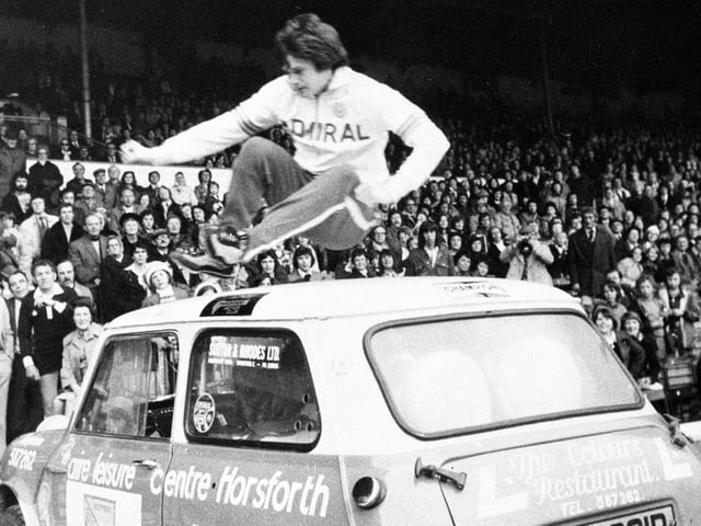 Leeds United star Duncan McKenzie showcased his 'party piece' of leaping over a mini car at Elland Road before Paul Reaney's testimonial game in May 1976.
