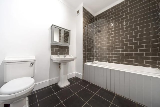 Located at the rear of the house on the first floor is the house bathroom. This is a large, tastefully decorated room with toilet, hand basin and bath with overhead shower within.