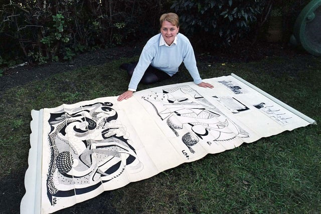 Amanda Gresham is pictured in September 1999 with an old kitchen blind found in a Bridlington house, covered with artwork by one of Britain's most famous living artists, David Hockney. The blind was expected to fetch up to £50,000 when it went under the hammer.