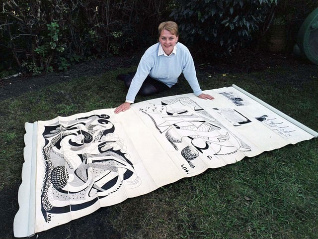 Amanda Gresham is pictured in September 1999 with an old kitchen blind found in a Bridlington house, covered with artwork by one of Britain's most famous living artists, David Hockney. The blind was expected to fetch up to £50,000 when it went under the hammer.