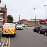 The police scene in Florence Street, Harehills, seen from Compton Road in Leeds.