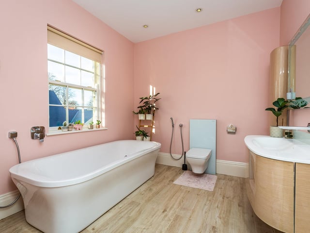 Unwind in this stylish bathroom.
