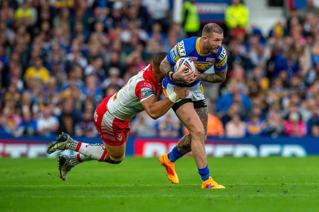 Zak Hardaker is tackled by St Helens' Will Hopoate during Rhinos' Grand Final defeat last month. Picture by Bruce Rollinson