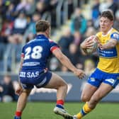 Leeds Rhinos' Joe Diskin faces up to Harvey Smith, of Wakefield Trinity, during the Boxing Day game. Picture by Tony Johnson.