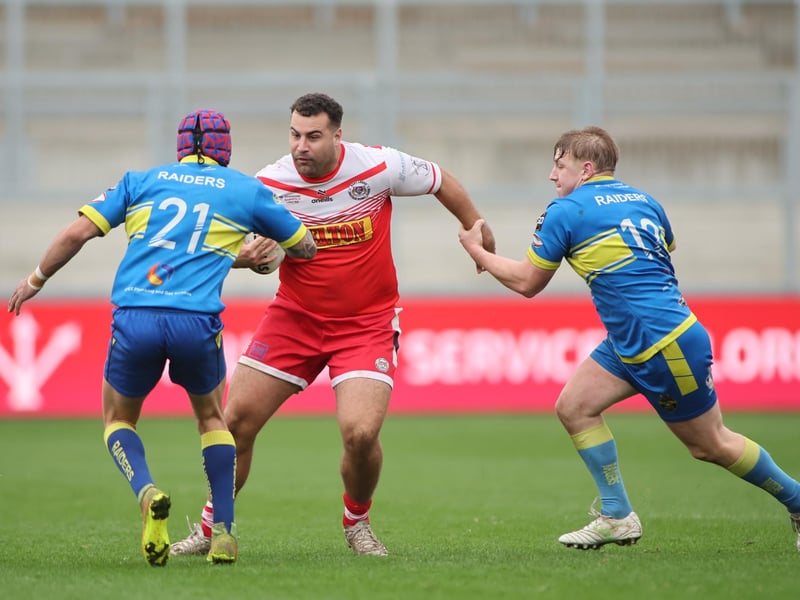 Jake Walker, of East Leeds, tries to find a way past Oulton Raiders' Nathan Waring and Ben Brady in the National League One play-off final.