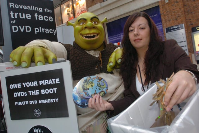 Kendra Taylor, fair trading officer of West Yorkshire Trading Standards and Shrek promote anti pirate dvd campaign in Leeds city centre, on November 24, 2004.