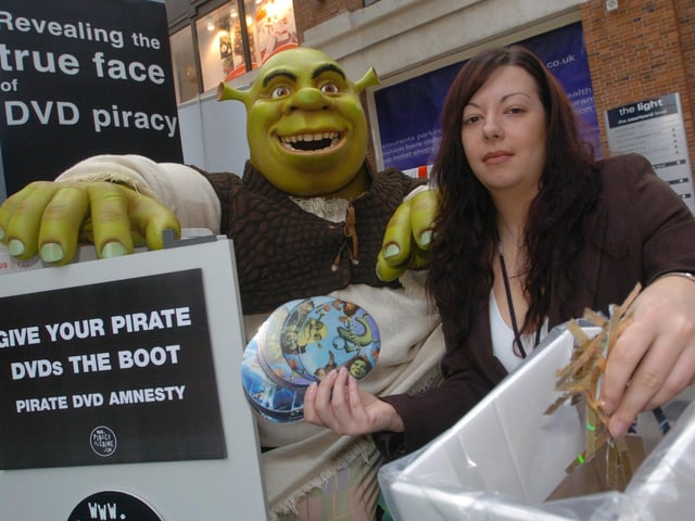 Kendra Taylor, fair trading officer of West Yorkshire Trading Standards and Shrek promote anti pirate dvd campaign in Leeds city centre, on November 24, 2004.