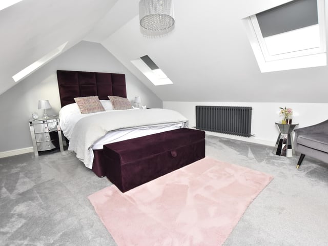 There are three bedrooms on the ground floor, two are double, one is to the front, one has French doors to the side and the other leads off from the kitchen and has a dressing area and an en-suite shower room with ceramic tiled floor and walls and a window to the rear.