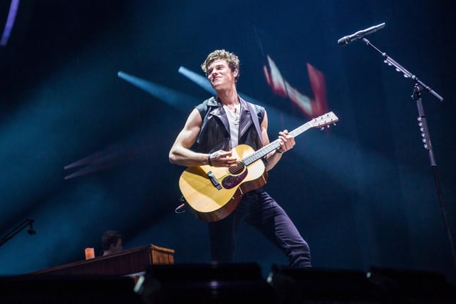 Canadian singer-songwriter Shawn Mendes pictured in concert in April 2019. Time magazine named him as one of the 100 most influential people in the world on their annual list in 2018.