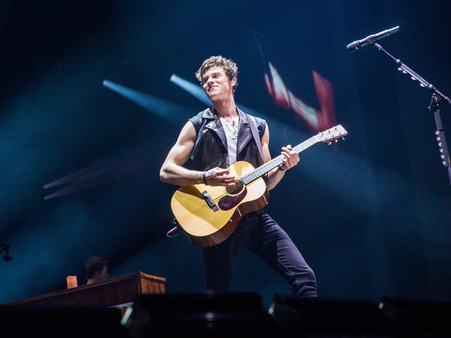 Canadian singer-songwriter Shawn Mendes pictured in concert in April 2019. Time magazine named him as one of the 100 most influential people in the world on their annual list in 2018.