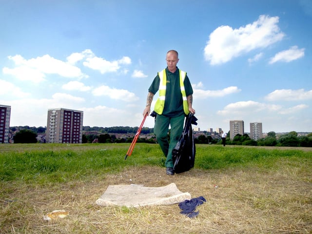Leeds City Council workers clear rubbish away from Killingbeck fields in August 2005 after a group of travellers moved on