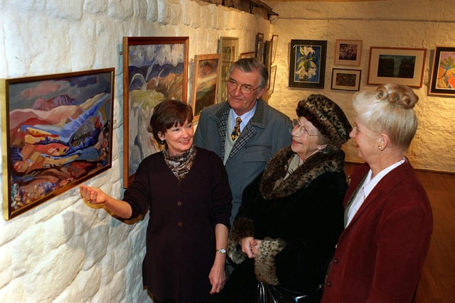 The Ilkley Manor House Museum and Art Gallery played host to an annual exhibition in January 1998 put on by members of the Burley in Wharfedale and Menston Art Clubs. Pictured viewing the works are, from left, Marion Gray, exhibition  secretary for the Menston club, visitors John and Greta Golding and Merel Jackson, assistant exhibition secretary for the Menston club.