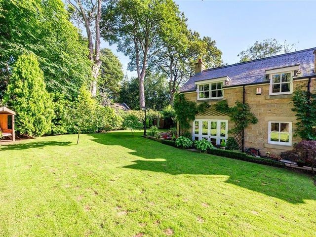 The established garden is predominantly to the front and partly to the side of the house and is mainly laid to lawn with mature planting, shrubbery and trees.
