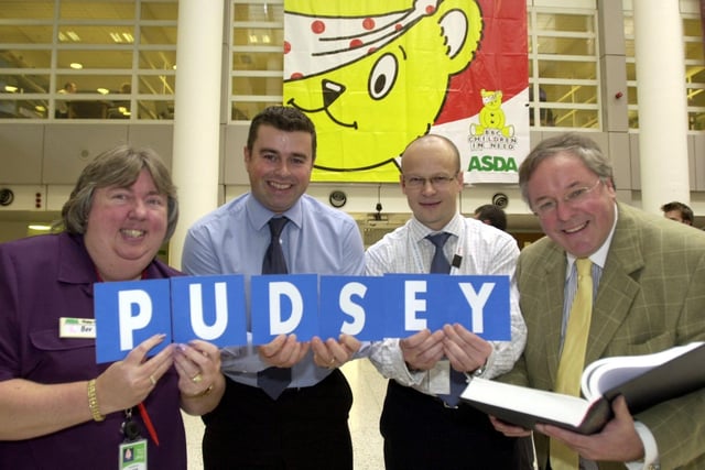 Asda staff held a Countdown fundraiser for Children in Need. Pictured is presenter Richard Whiteley with the winning team - Bev Leadbeater, Andy Adcock and Simon Stevens. A donation of £1,000 was donated to the charity from the event in November 2003.