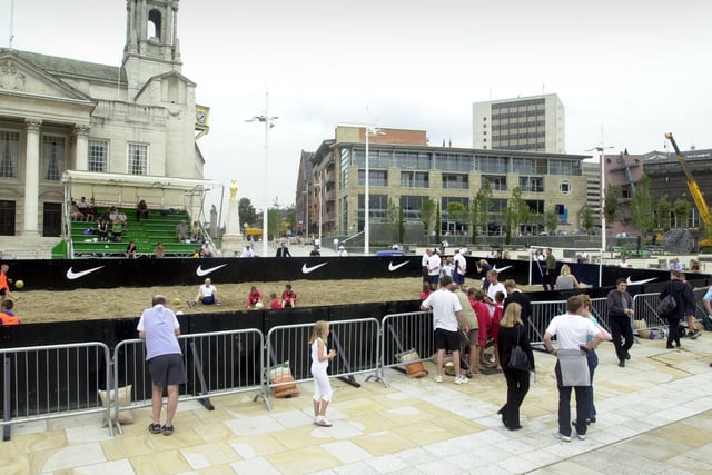 The Nike Beach Soccer Tour takes over Millennium Square in Leeds city centre, featuring sand and football bleachers.